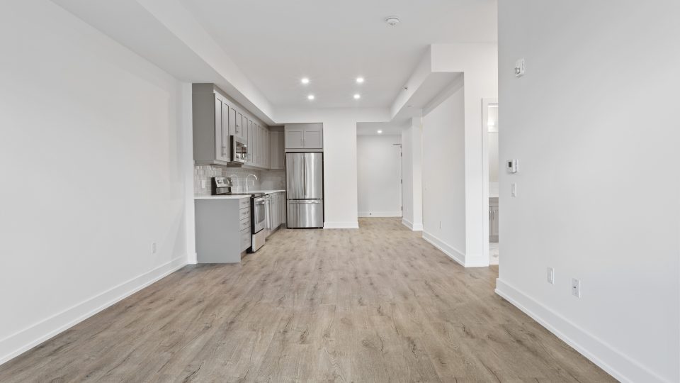 brown wooden parquet floor and white wall